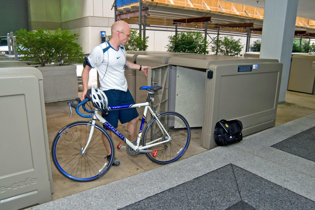Employee bike commuter using secure bike locker