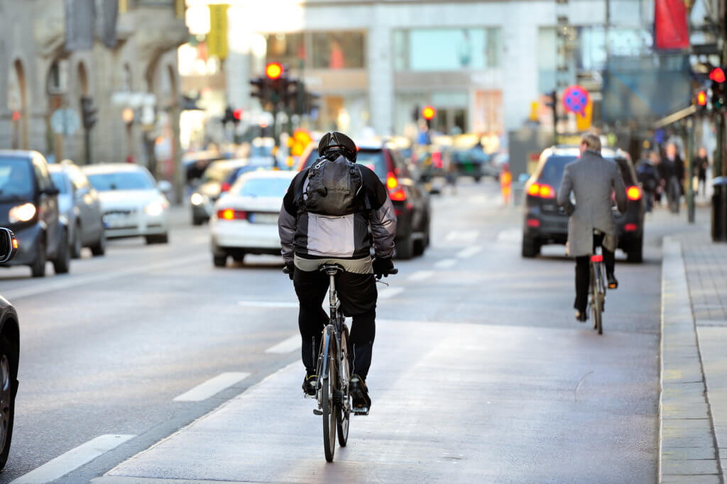 Bikers commuting to work in urban center